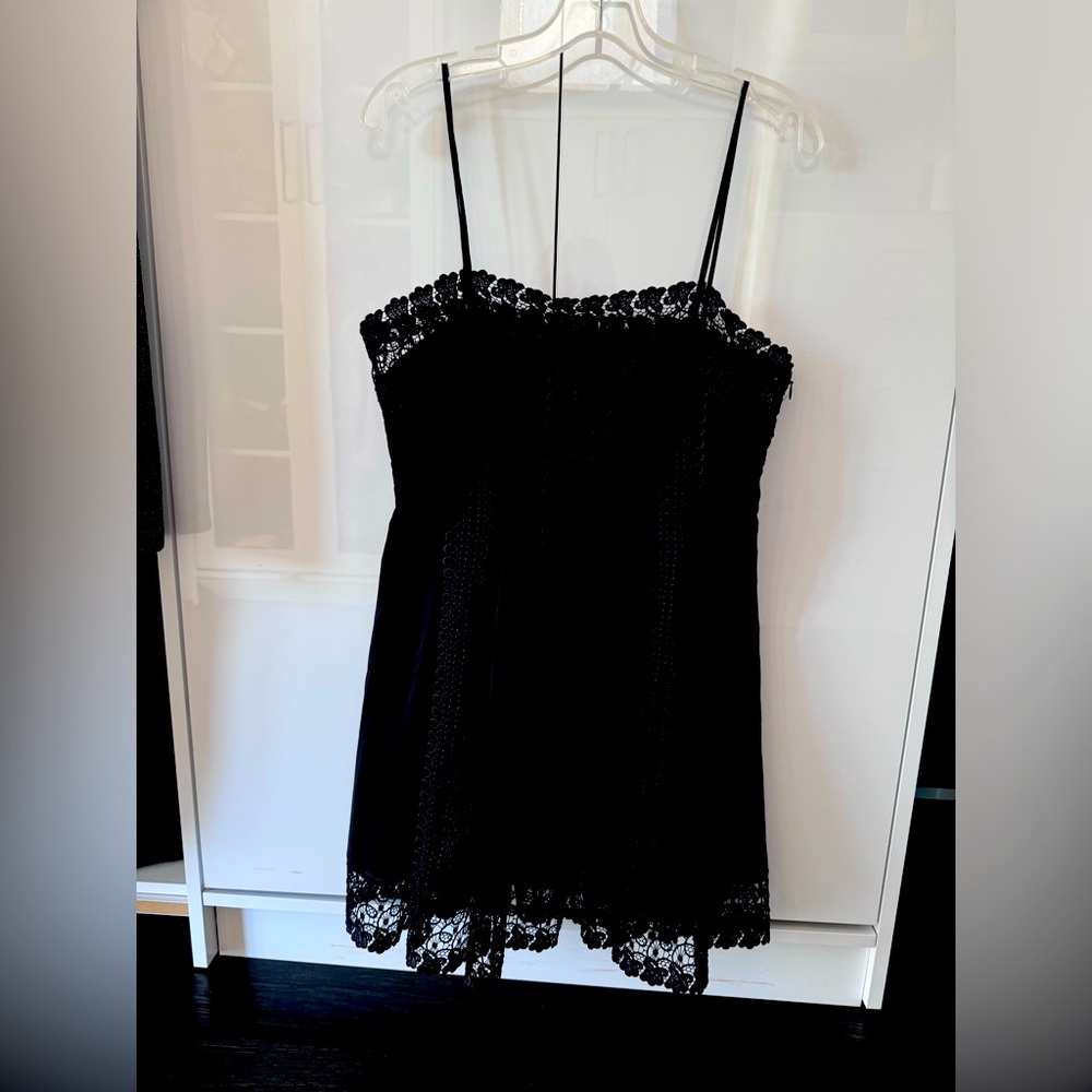 delicate spaghetti straps and interlacing detailing on the torso and the skirt.